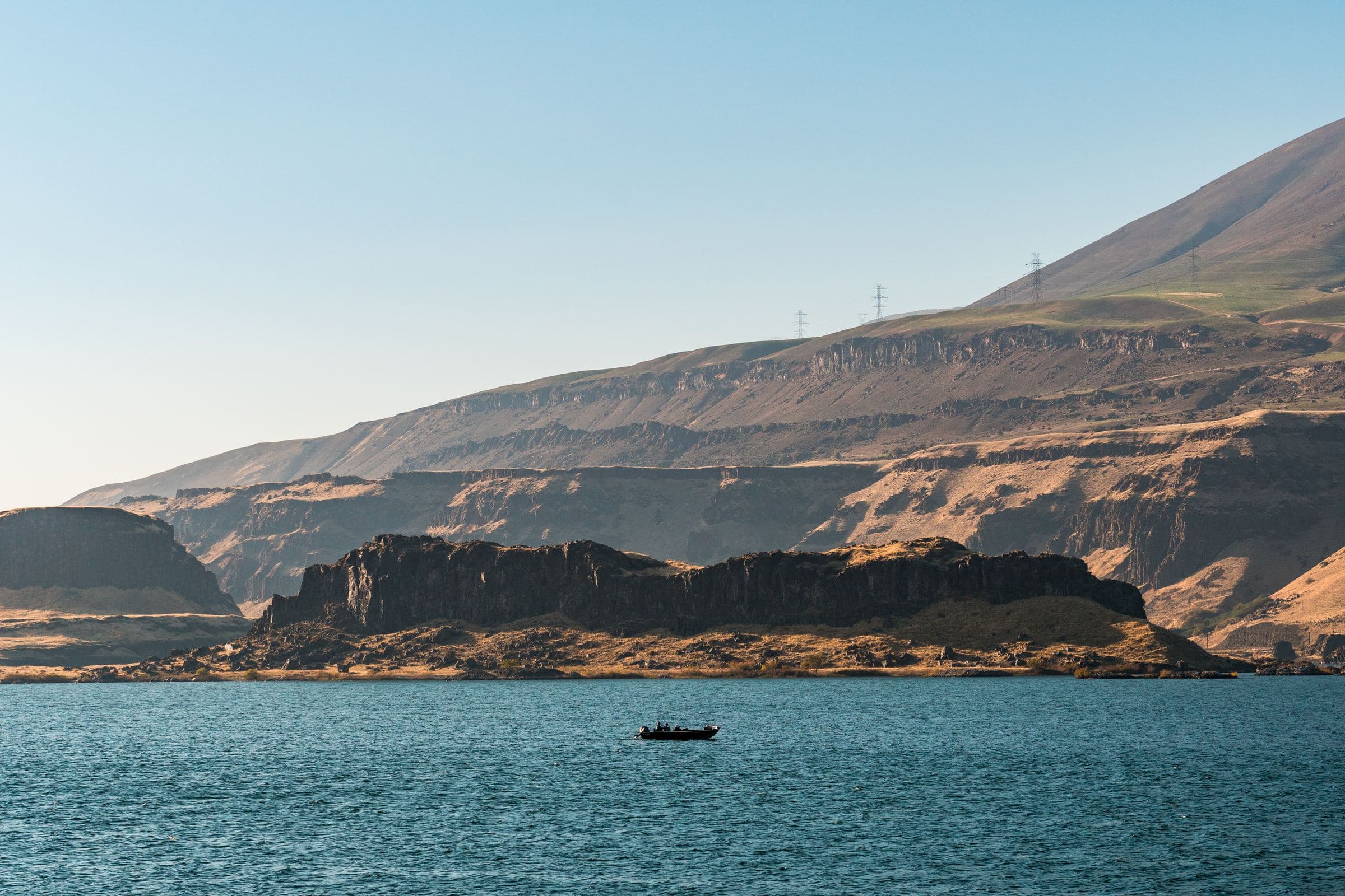 The Columbia River below the basalt cliffs of the eastern Gorge, the state line between Oregon and Washington